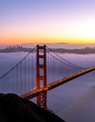 Fototapeta premium Golden Gate Bridge at sunrise, shrouded in mist (1)
