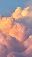 Puffy, golden clouds against a blue sky, lit by the setting sun's warm glow