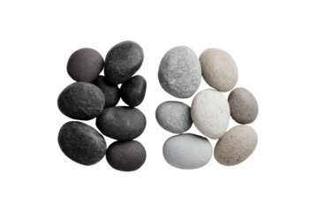 Two stacks of smooth, various-toned stones, forming an abstract shape against a black background.  The stones are dark grey, light grey, and beige