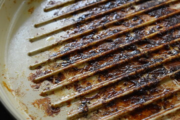 dirty white circle pan after cooking in home