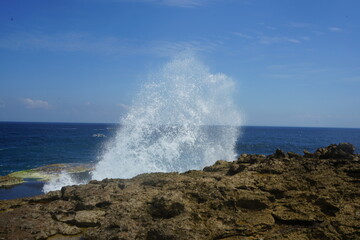 wave crashing on rocks