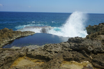 wave crashing on rocks