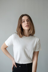 Woman White Tee Black High-Waist Jeans Portrait