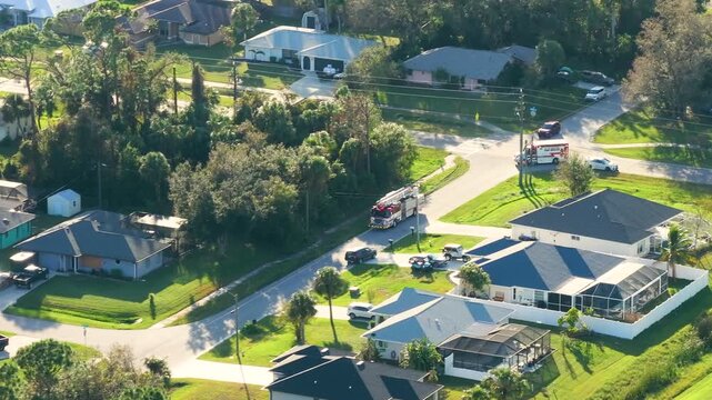 Fire rescue truck drive on Florida road. Emergency service vehicle on city street in USA.