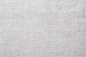 Close-up view of a light beige woven fabric