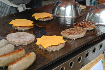 Chef making cheeseburgers on a griddle