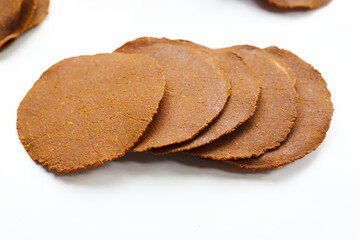 Sun-dried fermented soybean sheets called “Thua Nao,” a traditional ingredient in Northern Thai cooking.