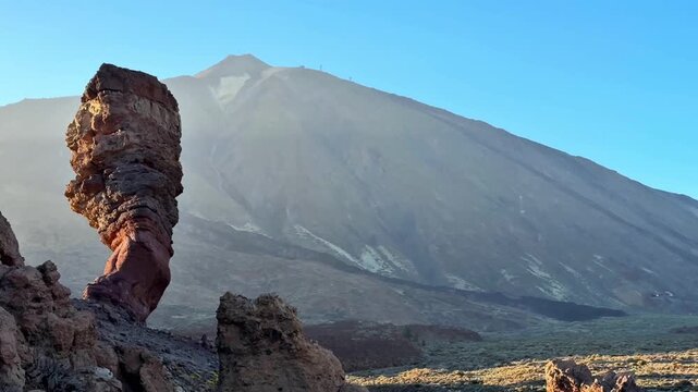 The stunning view features a unique rock formation with Teide Volcano in the background, showcasing natures beauty