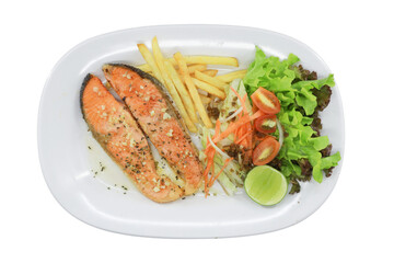 Grilled Salmon with Fresh Salad: A mouthwatering dish of perfectly grilled salmon fillets is accompanied by golden-brown french fries, fresh greens, and a zesty lime.