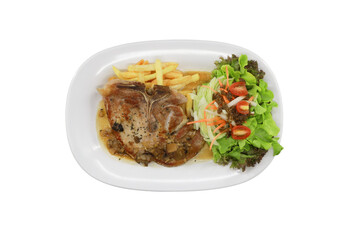 Culinary Delight: A mouthwatering steak, accompanied by golden fries and a fresh salad, presented on a pristine white plate.