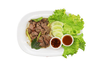 Thai Grilled Beef Salad: An overhead shot captures the zesty essence of Thai cuisine with a flavorful grilled beef salad, artfully arranged on a white plate with crisp lettuce and refreshing cucumber.