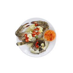 Exquisite Crab Cuisine: A top-down shot of an alluring crab dish, featuring a succulent crab with garnishes and a vibrant sauce, all artfully presented on a pristine plate.