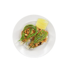 Gourmet Dish: An overhead shot showcases an appetizing culinary creation, artfully arranged on a pristine white plate.