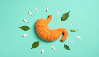 Fototapeta premium Crocheted Stomach Surrounded by Nature Vibrant Teal Background.