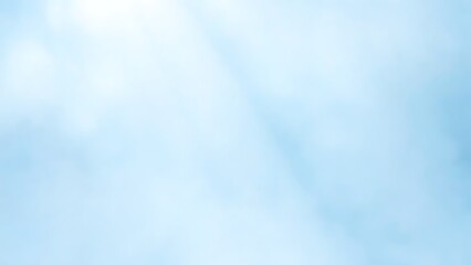 柔らかな光が差し込む水色の空と雲の背景
