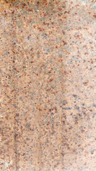 Rust-stained vertical corrugated iron surface showing natural weathering, oxidation, and industrial texture patterns perfect for aged backgrounds, texture design, and retro grunge concepts.