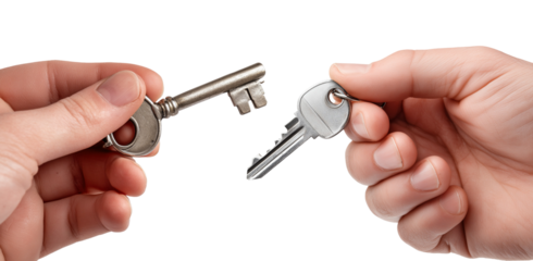 Two hands holding different metal keys