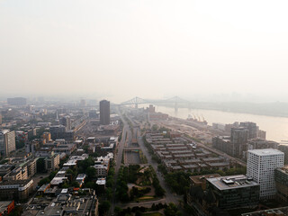 Fototapeta premium Heavy smog in Montreal downtown because of wildfire and industrial pollution, Quebec, Canada