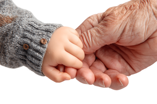 A baby gently holds the hand of an elderly man, capturing a tender moment between generations