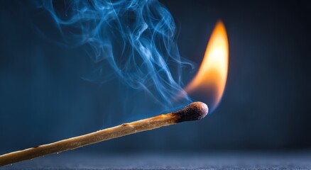 Close-up of a burning match with smoke.