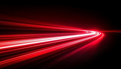 Dramatic red light trails creating sense of speed and dynamic energy on black backdrop