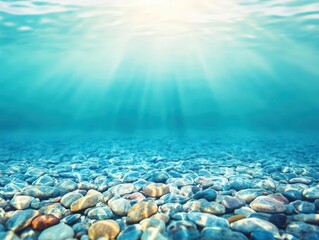 Obraz premium Underwater view of crystal clear water with sunlight rays penetrating through the surface and smooth colorful pebbles at the seabed in a peaceful aquatic scene