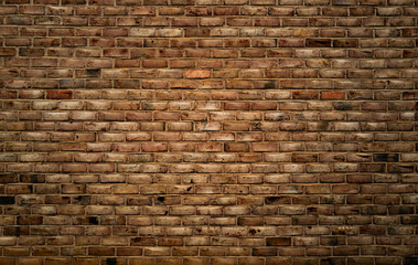 Brick wall, vintage texture. Red brick wall for construction themes. Brick wall background. Textured bricks for design projects. Solid bricks structure close-up. Brick wall pattern.