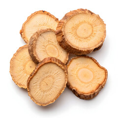 Thin slices of dried galangal root arranged on a white background, showcasing their fibrous texture,