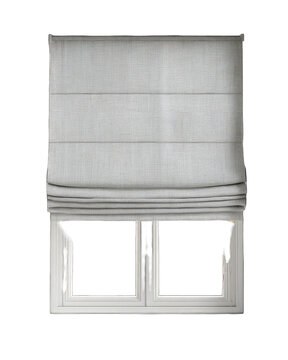 Light beige roman shade covering a double window