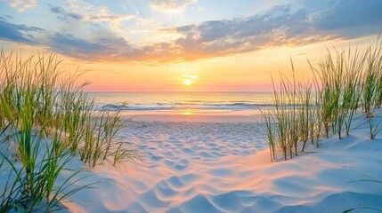 A serene beach scene at sunrise. Golden sunlight streams through a vibrant sky filled with fluffy clouds, illuminating a sandy beach. 