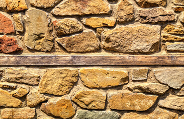 Colorful stone wall background close up view