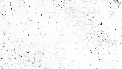 Naklejka premium Abstract black paint splatters and speckles on a white background creating a textured artistic effect suitable for design projects and creative backgrounds