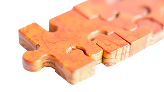 Close up of connected puzzle pieces in shades of orange and brown on a black background space