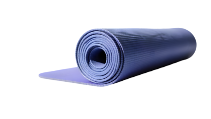 Close up of a rolled up blue yoga mat on a black background in a studio setting with good lighting