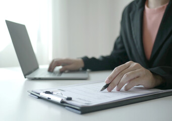 Businesswoman employer holding resume, recruiting, planning, evaluating and reviewing resume of job applicant, recruiting new employees, recruitment concept