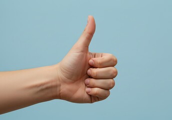 Hand Giving Thumbs Up on Solid Blue Background
