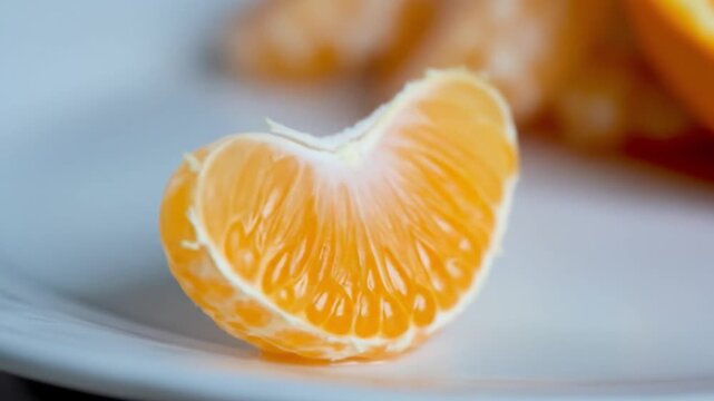 Close up slices of fresh peeled mandarin orange, vibrant, healthy, and visually appealing, food