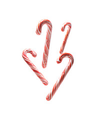 Obraz premium Five red and white candy canes arranged together in mid-air