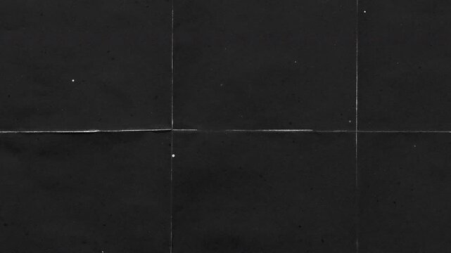 Vintage paper texture with subtle grain.Scratches suitable for overlaying and backgrounds,Black kraft paper noise texture 4K stop motion video. Aged old page overlay effect background loop animation