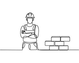 Construction worker with crossed arms next to a brick wall