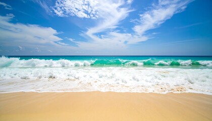 Serene Tropical Beach with Turquoise Waves and White Clouds Under a Blue Sky.