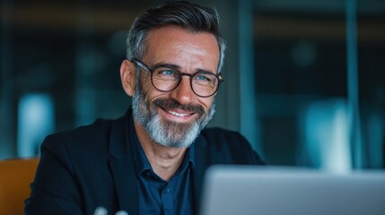 happy mature business man executive manager looking at laptop computer watching online webinar or having remote virtual meeting video conference call negotiation corporate training working in office 