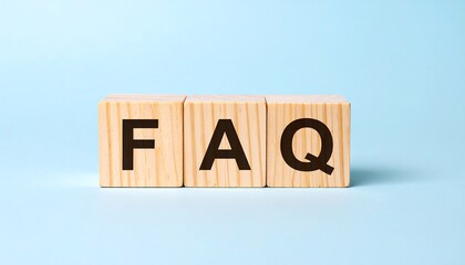 Light wooden blocks displaying the letters FAQ