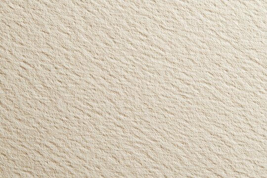 Close-up of a light beige textured surface with subtle diagonal lines