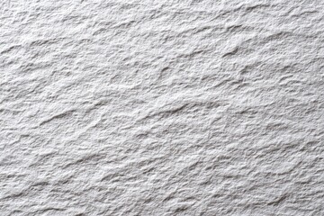 Close-up of textured, light gray stone surface