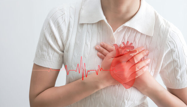 Close up of woman suffering chest pain holding heart, heartbeat graph overlay, heart attack, cardiovascular disease, healthcare and medical concept, isolated on white background.
