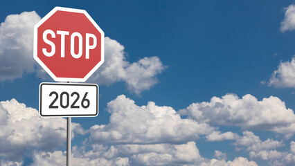 Stop Sign with the number 2026 against slightly clouded sky an a reminder for changes and opportunities in the year 2026