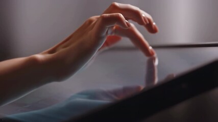 Woman scrolling on tablet screen with finger gestures