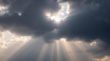 Sun rays piercing dramatic clouds