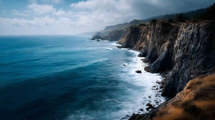 Obraz premium Majestic coastal cliff overlooking the deep blue ocean